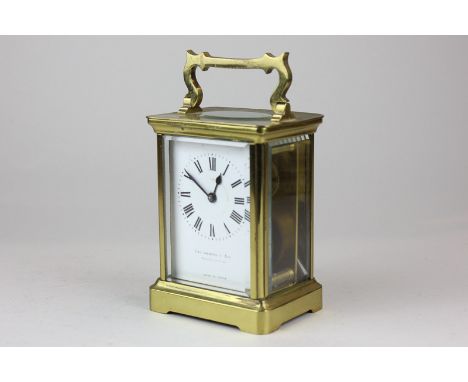 A brass and bevelled glass cased carriage clock, the white enamel face marked Collingwood & Son, Middlesborough with Roman nu