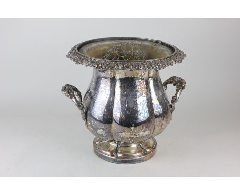 A silver plated two-handled planter with flared rim and scroll decoration, height 23cm