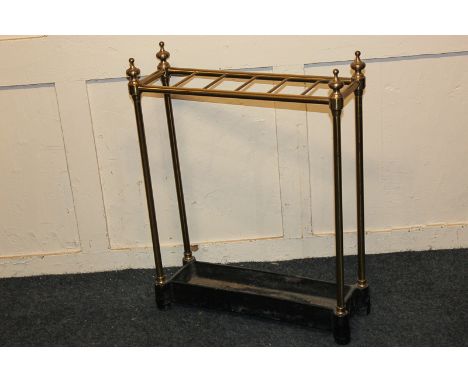 A brass rectangular stick stand with cast iron base, 49cm