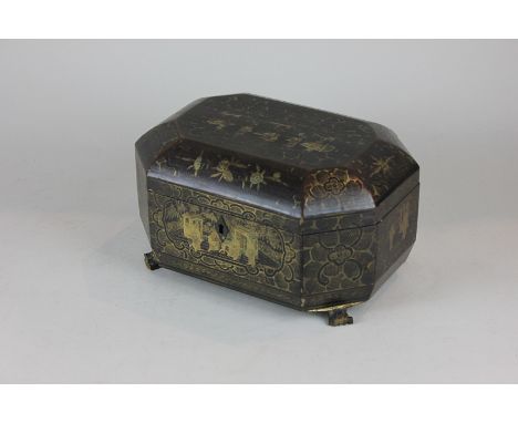 A Chinese black lacquered tea caddy containing two pewter canisters and lids, with gilt decoration on paw feet, 24cm