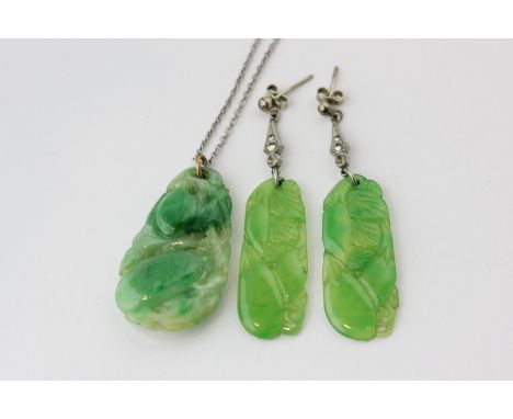 A carved jade pendant and a pair of imitation jade drop earrings