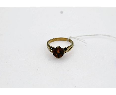 gold ring with a claw set round citrine size P