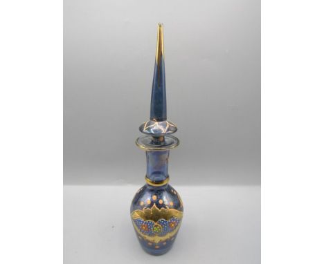 A Venetian antique blue glass bottle with enamel detail