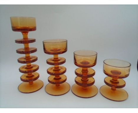 4 graduated Wedgwood Sheringham amber/topaz glass candle holders designed by Ronald Stennett Wilson to incl five ring, three 