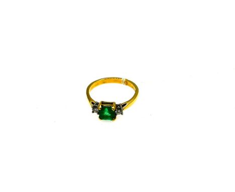 18ct yellow and white gold ring ring with Emerald (6.5mm x 6.5mm) and a claw set diamond on each shoulder (total approx diamo