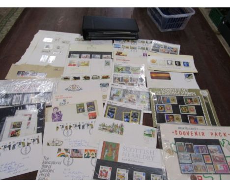 Loose First day covers and stamp sets plus an album of first day covers of around 60