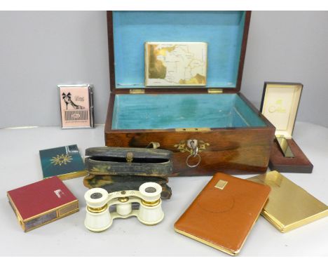 A 19th century rosewood workbox with brass and mother of pearl inlay, opera glasses, cigarette cases and lighters