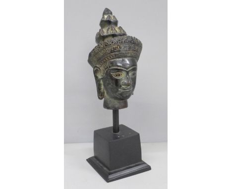 A Thai bronze head of Buddha on plinth 