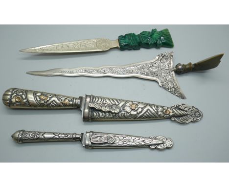 Three letter openers, a Kris, one marked Mexico and one with scabbard marked Alpaca Argentina, and a dagger with scabbard and