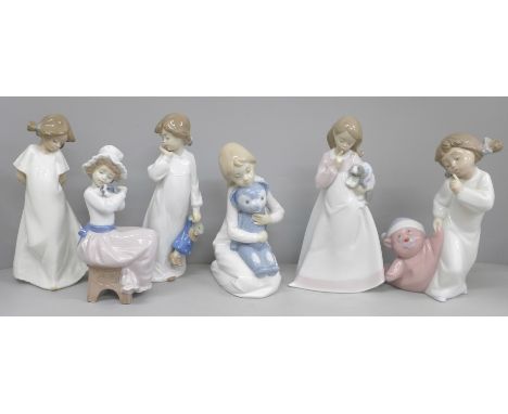 A collection of Nao figures, 'A Big Hug', 'And Now to Bed', 'Ssh Everyone's Sleeping', all boxed and three girl figures with 