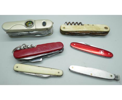 A set of pen knives including multi-tool knives 