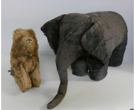 An Isa Animated Toys plush black elephant with spring legs, trunk a/f and a clockwork bear, both 1920s