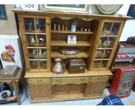 Pine Dresser with Open Shelves flanked by Two Glazed Shelves above Three Drawers, Two Cupboards and a Pot Shelf