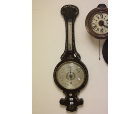 A rosewood wheel barometer with silvered dial signed Angelinetta, Wootton Bassett, the neck set with a mercury thermometer, t