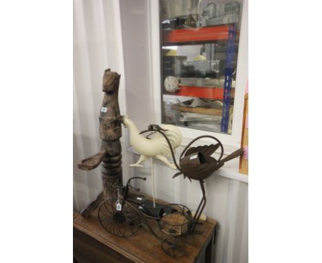 A carved hardwood standing animal together with a iron floor standing watering can and a painted metal cockeral plus small ga