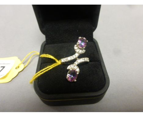 A silver, CZ & mystic topaz ring