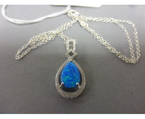 A silver, CZ & blue opal drop pendant necklace on a silver chain