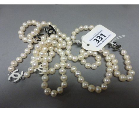 A long freshwater pearl necklace with Chanel style spacers