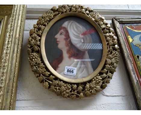 A pierced gilt framed oil painting portrait of an elegant colonial lady