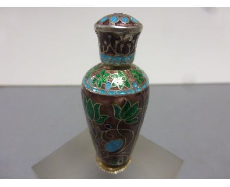 A silver plated and enamel set perfume bottle