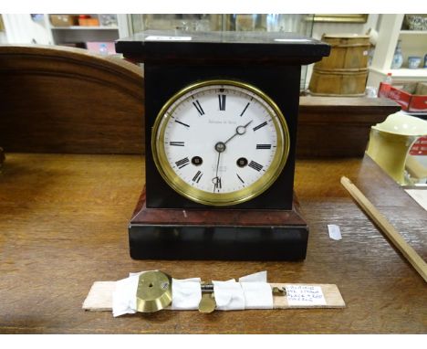 An early 20th century Fabrique de Paris twin colour mantle clock; of tapering rectangular form; with white enamel dial and bl