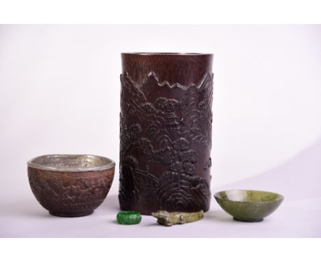 Chinese bamboo brush pot carved with mountainous landscape, 16.3cm high; together with a carved coconut shell cup, a spinach 