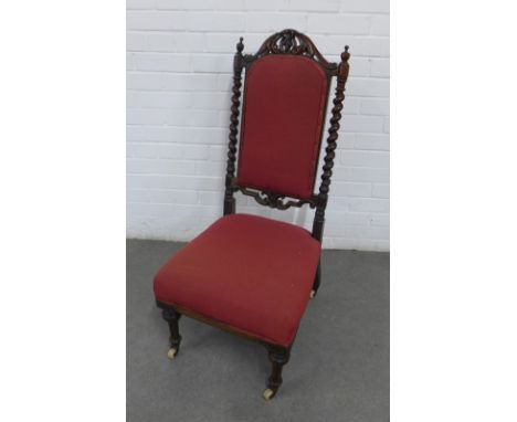 Mahogany chair with leaf carved top rail and barley twist uprights with red upholstered back and seat, turned front legs term