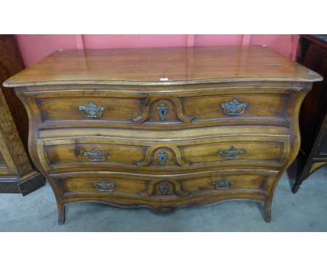 A French Louis XIV style fruitwood bombé commode