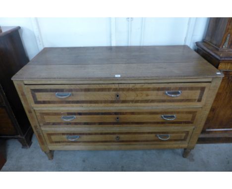 A 19th Century French oak and mahogany crossbanded commode