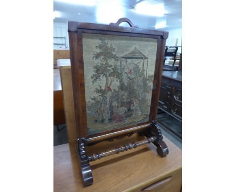 A Victorian mahogany fire screen