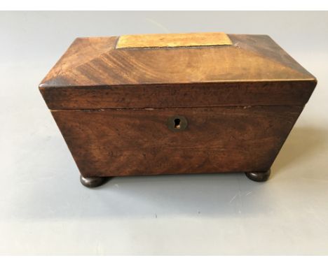 *A mahogany sarcophagus shaped tea caddy.