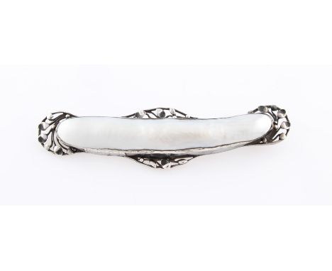 A mother of pearl brooch, with open metalwork leaf design surround, unmarked white metal, width approx. 10.5cm.