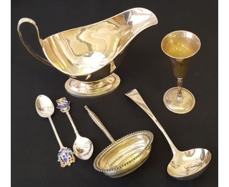 A Georgian silver ladle, hallmarked 1813, together with a silver sauce jug, hallmarked Sheffield 1964, a Georgian ladle bowl 