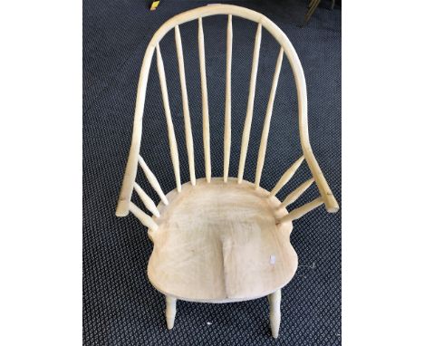 An oak stick back arm chair.