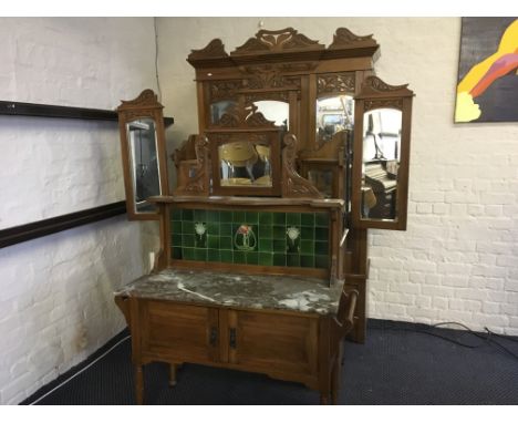 A satin wood Edwardian bedroom suite with marble topped tile back washstand, mirror back dresser and wardrobe.