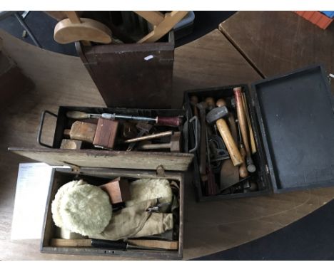 A collection of workman's tools in four boxes.