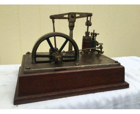 A fine freelance model of a small live steam beam engine on metal and mahogany plinth, 11 1/2 x 7 1/2", finished in bright st