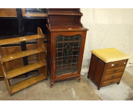 An Edwardian music cabinet with single leaded-light door, 55cm wide, 122cm high, a hanging wall shelf and a four-drawer music