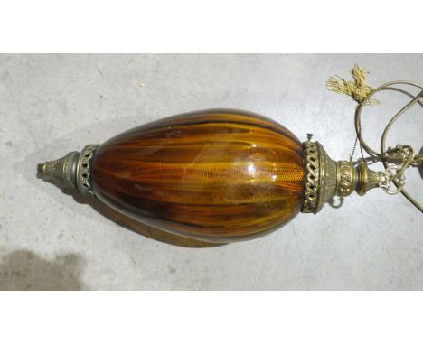A metal and amber glass light fitting of teardrop shape, 61cm high.