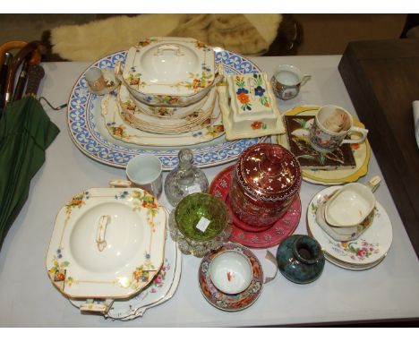 A gilt and enamel-decorated cranberry glass biscuit barrel on stand, a crocus pattern Clarice Cliff plate, a Chinese transfer