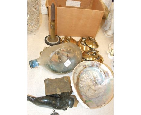 A ship in glass bottle, eleven horse brasses, a Polish trench art lighter and other items.
