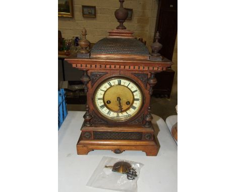 An Edwardian stained wood architectural mantel clock, 47cm high.