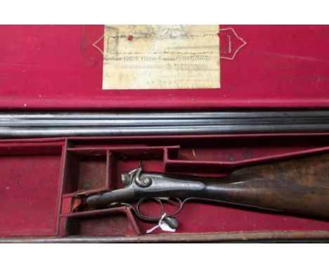 Cased Boss and Co 12 bore hammer gun with 30" barrels with under lever opening, serial number 2088, in fitted leather case wi