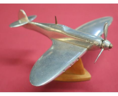 Aluminium scale model of a Spitfire mounted on wooden stand (approx height 9cm) 
