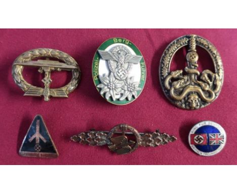 Selection of German military and other badges including an enamel British Union of Fascist, a triangular German enamel badge 