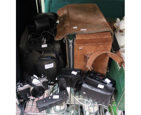 A selection of photographic equipment to include Nikon cameras and a Sony video recorder etc