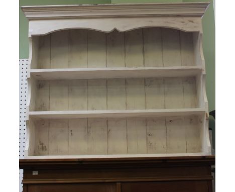 A white painted three shelf unit
