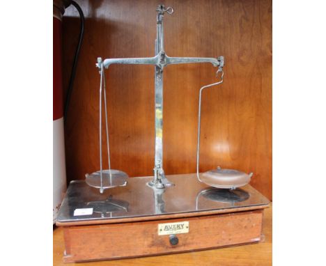 A set of Avery scales on wooden base with drawer containing weights
