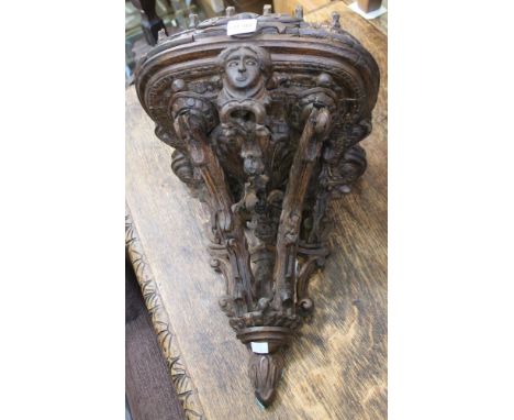 A 19th century carved and stained pine European wall bracket, possibly for a clock or statue, having mast decoration, width o