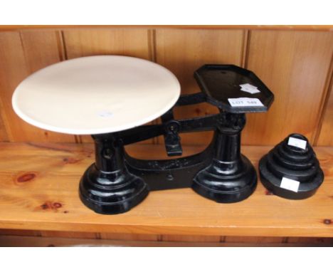 A set of vintage weighing scales, with weights